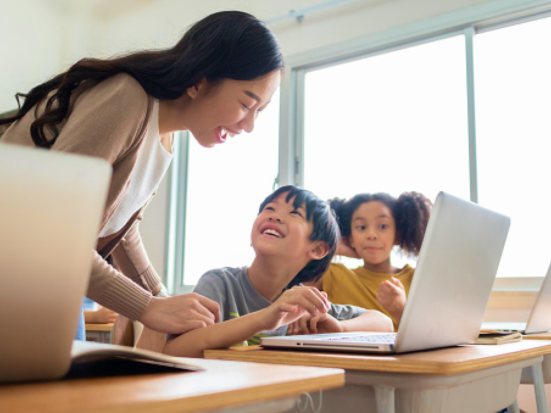 Teacher helping students