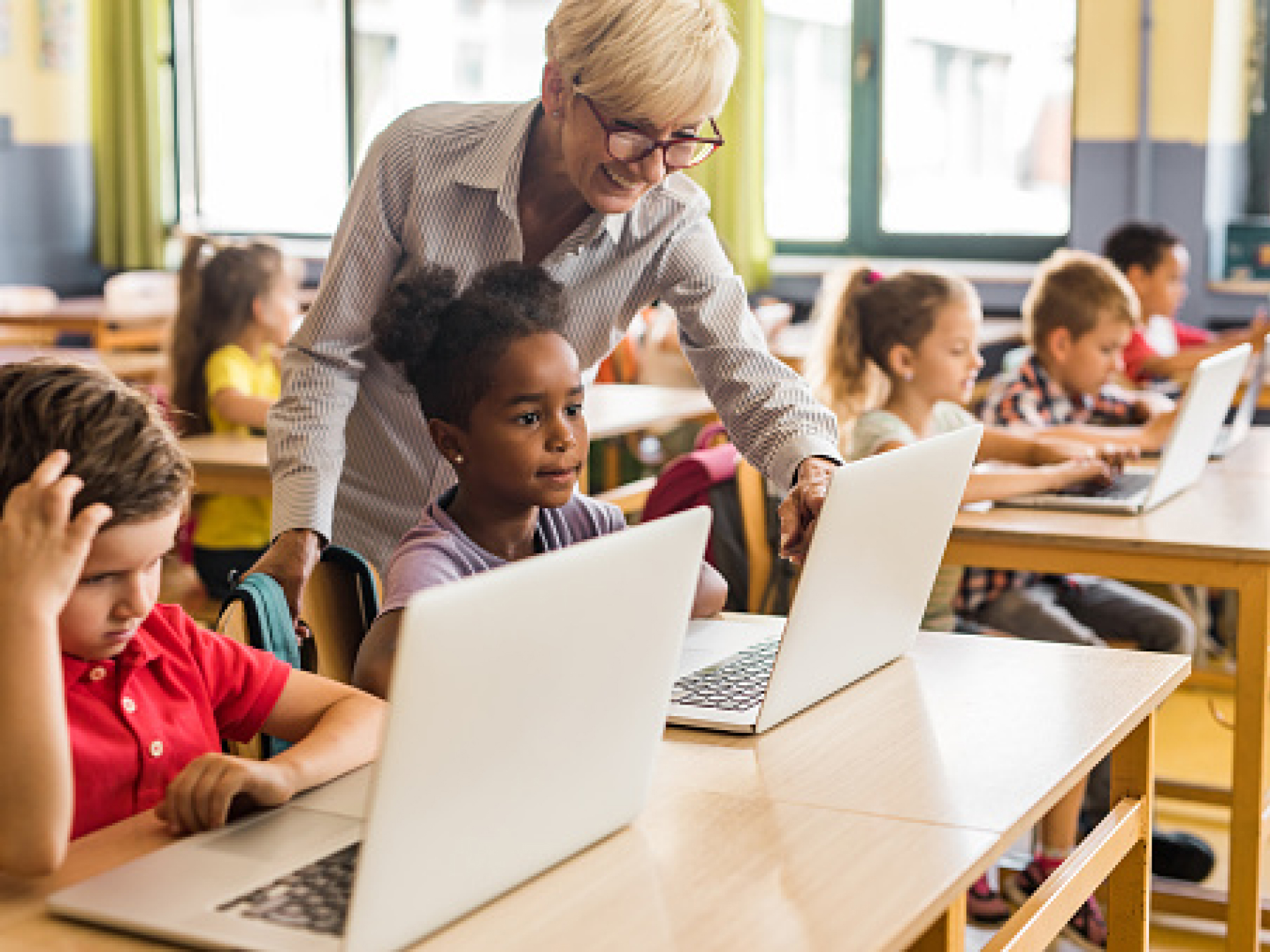 Teacher helping student